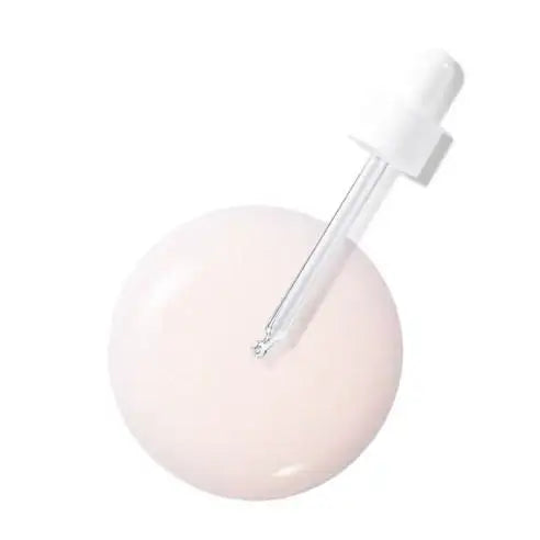 Pink skincare serum drop with glass dropper, holistic beauty routine