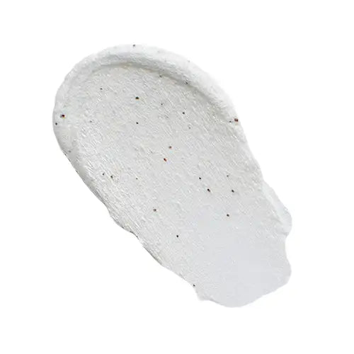 White textured skincare cream with exfoliating beads on clean background