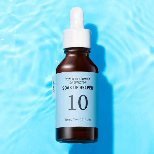 Soak Up Helper Power 10 Formula GF Effector serum in amber bottle with dropper on blue water background